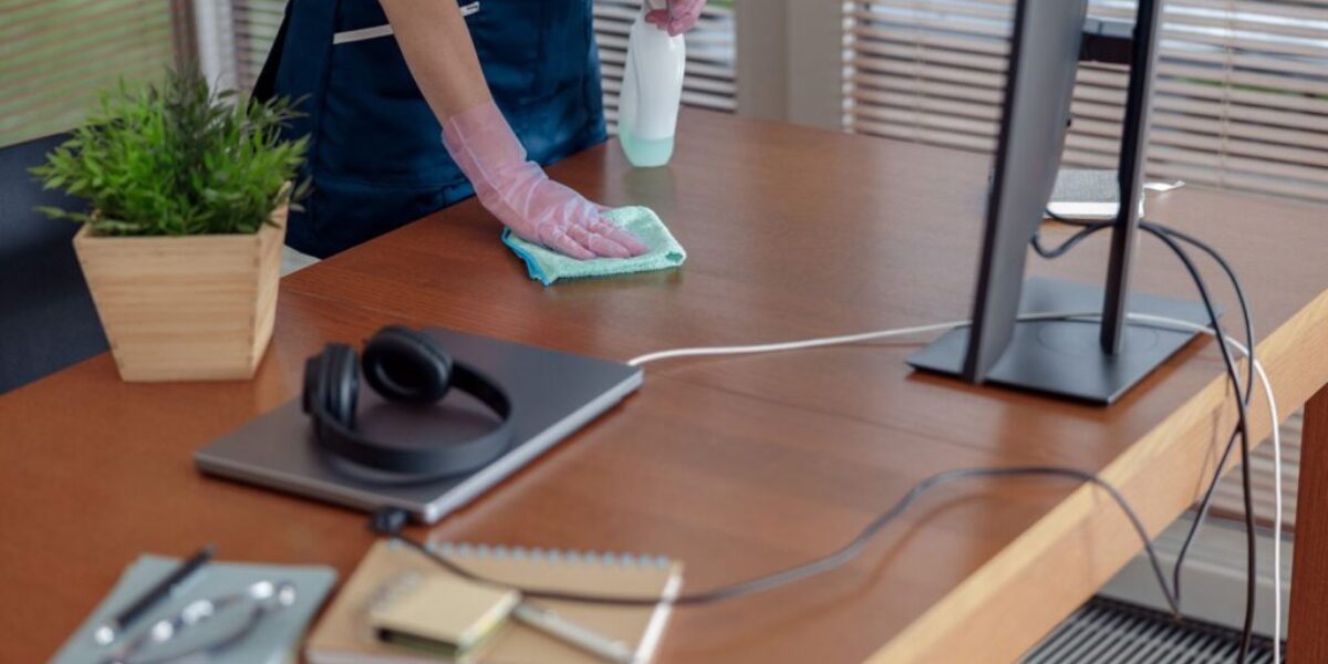 Close up of cleaning lady wiping dust off furniture in apartment. General or regular cleanup in room Close up of cleaning lady wiping dust off furniture in apartment. General or regular cleanup in room